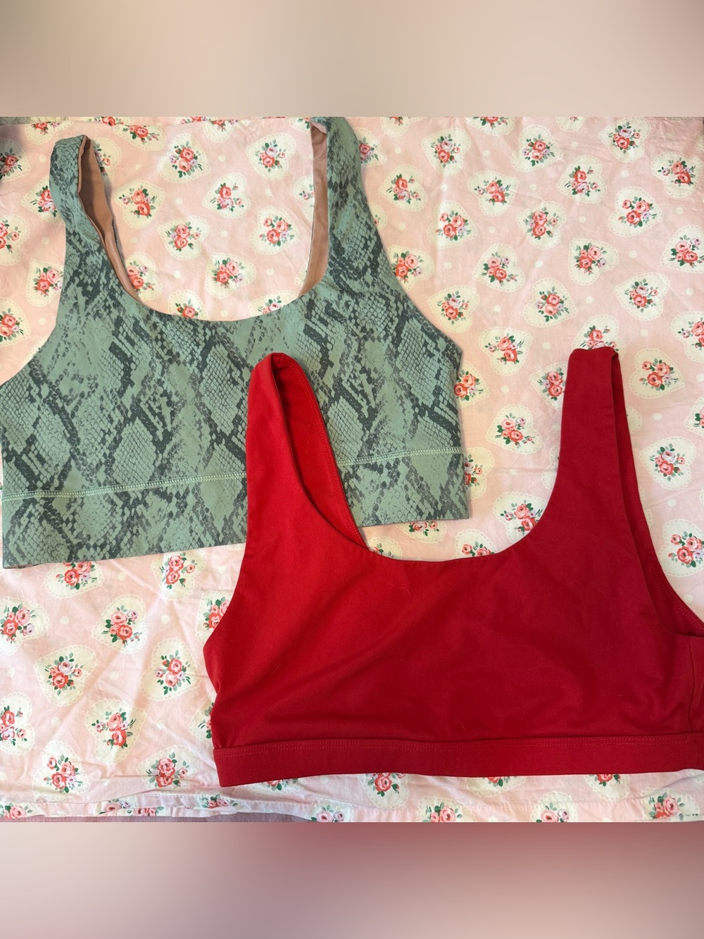 Fabletics Set of 2 light/medium support sport bras- Green snake print, solid red